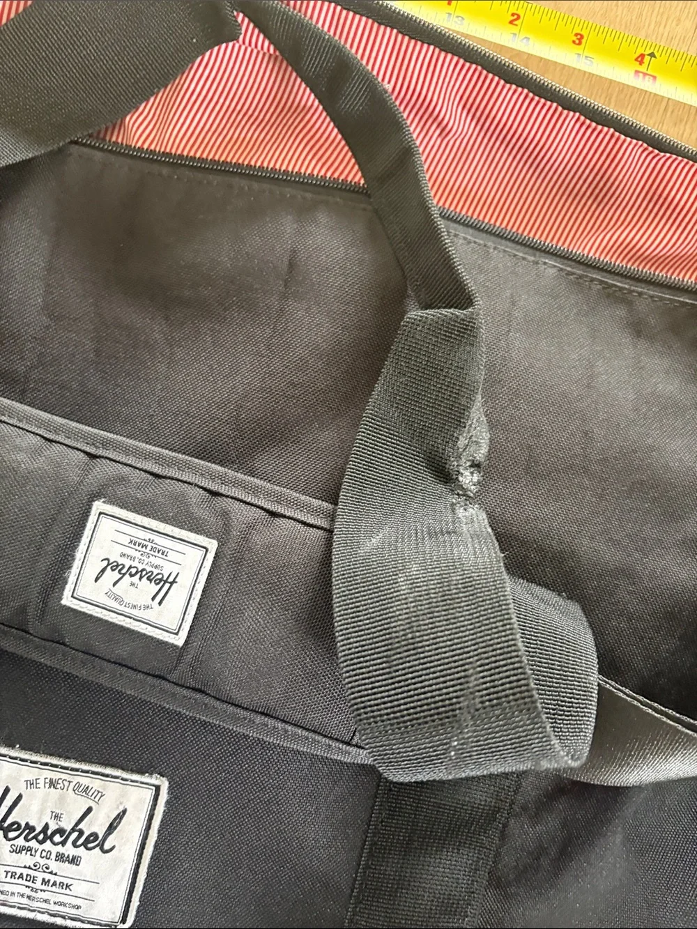 Herschel Supply Company Black Duffel with Burgundy Interior Trim